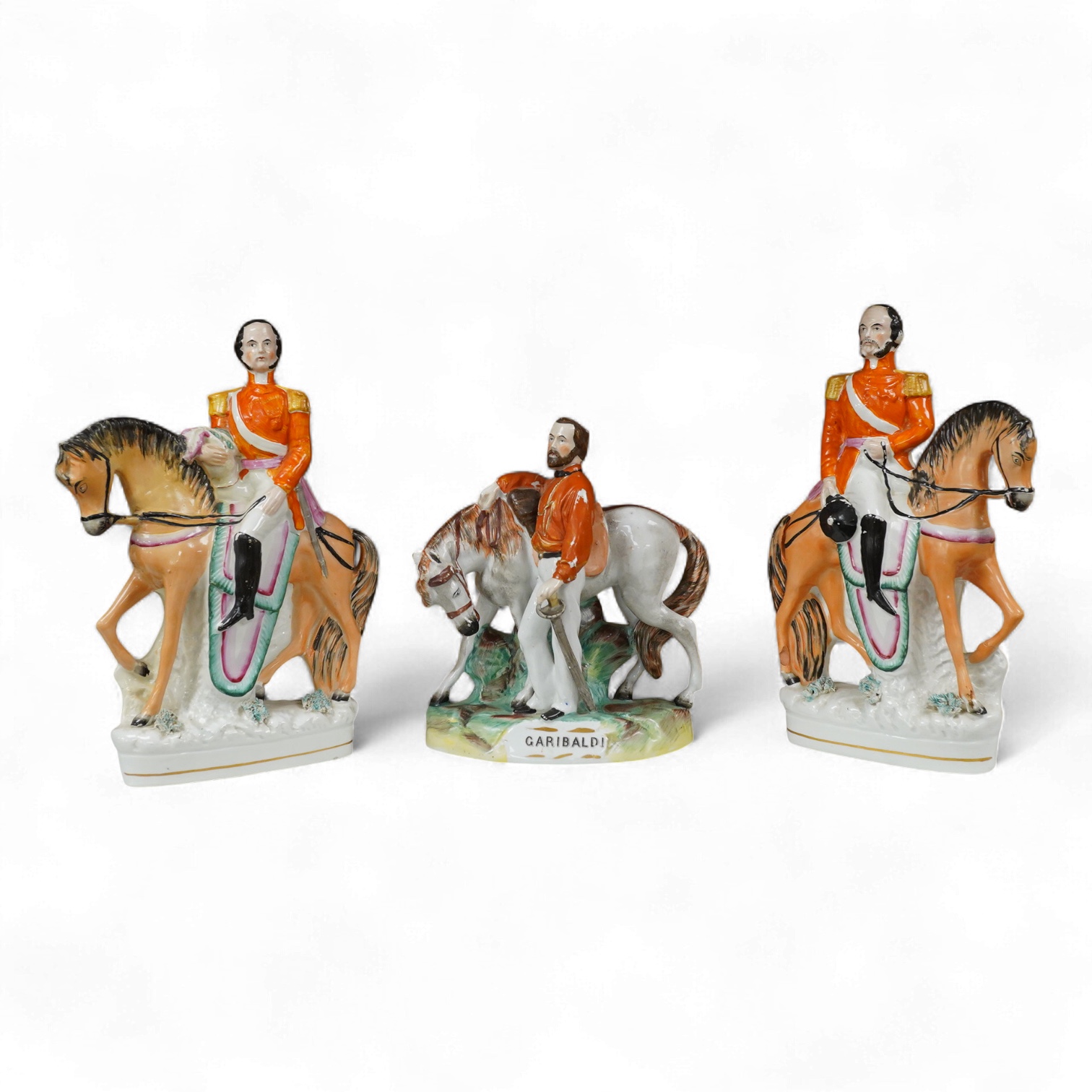 Three Staffordshire flatback figures of Garibaldi, mid 19th century, largest 29cm high